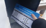 collection schedule being delivered in a mailbox