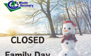Winter scene with snow covered fields and trees with a snowman. Text reads Closed Family Day.